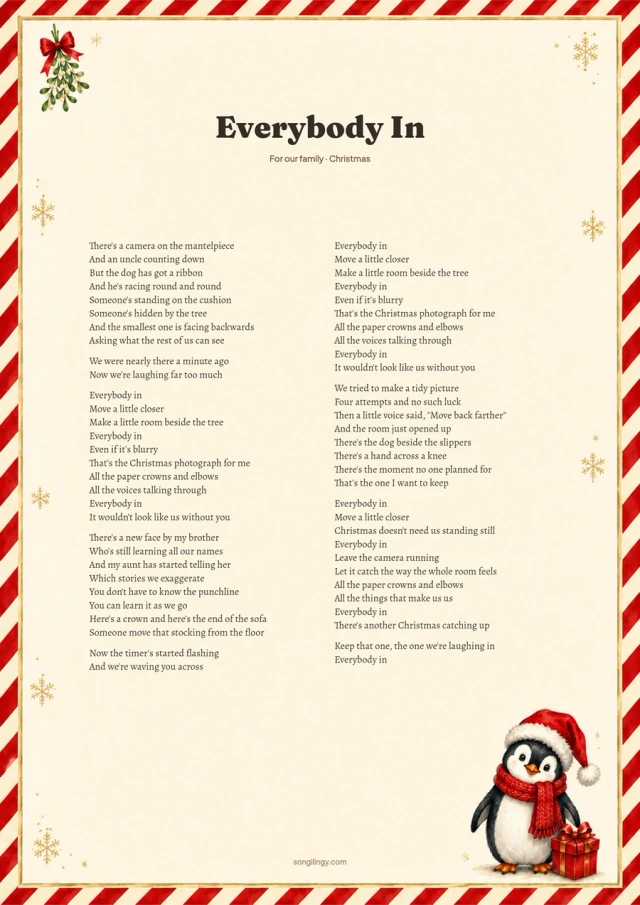 Christmas song lyrics on cream paper with a penguin in a red Santa hat