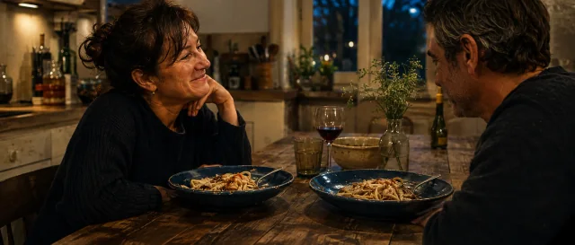 A wife and her husband sharing dinner on their familiar blue plates